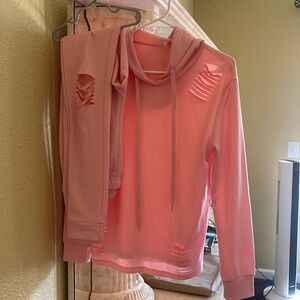 Pink sweater and sweats
